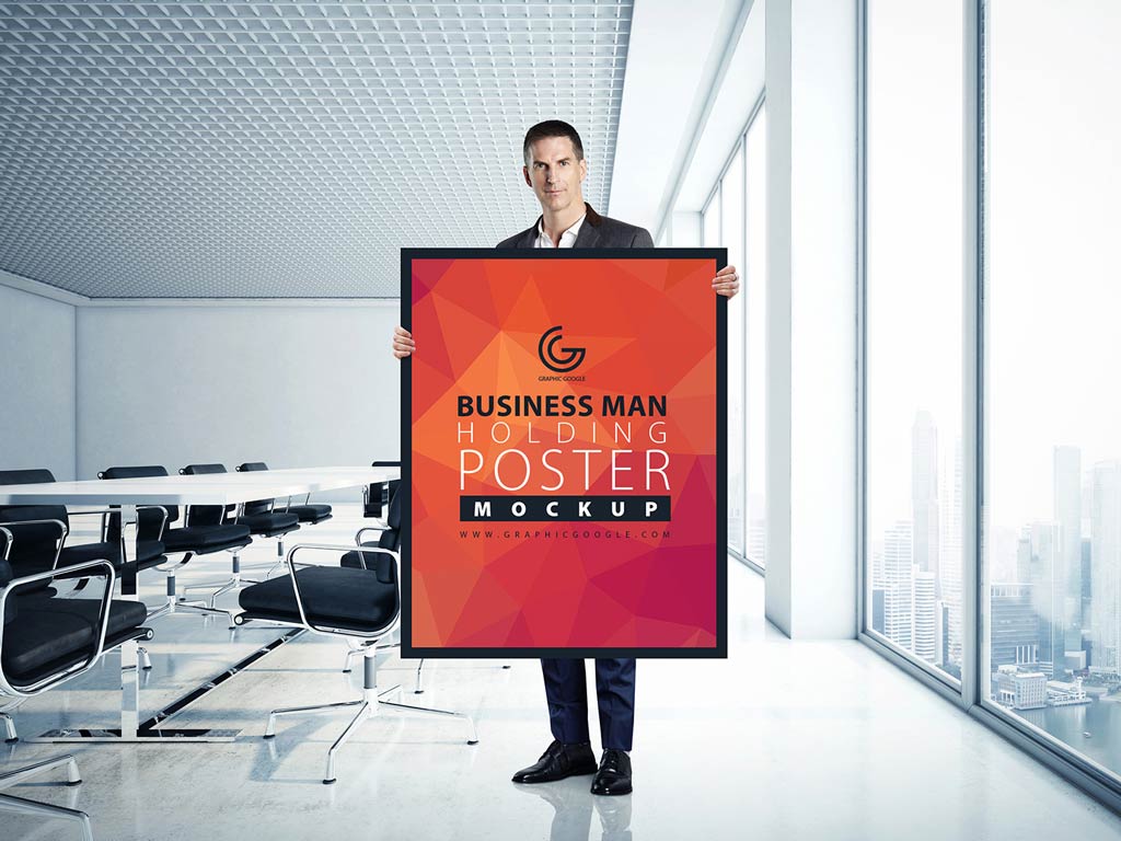 Download Businessman holding Poster Mockup | Mockup World