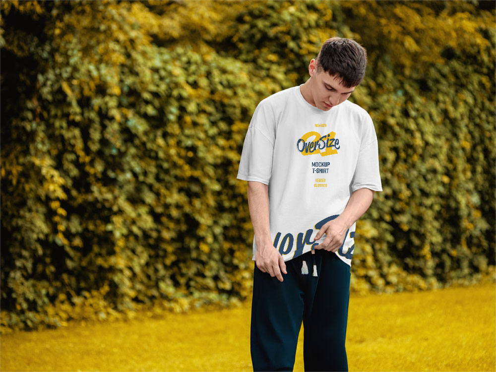 Download Young Man wearing oversized T-Shirt Mockup | Mockup World