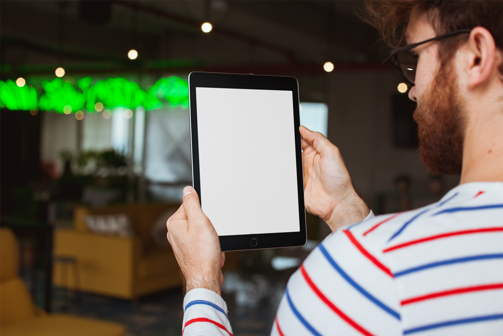 New Free Mockups – Man holding iPad in Restaurant Mockup Generator – Download Now