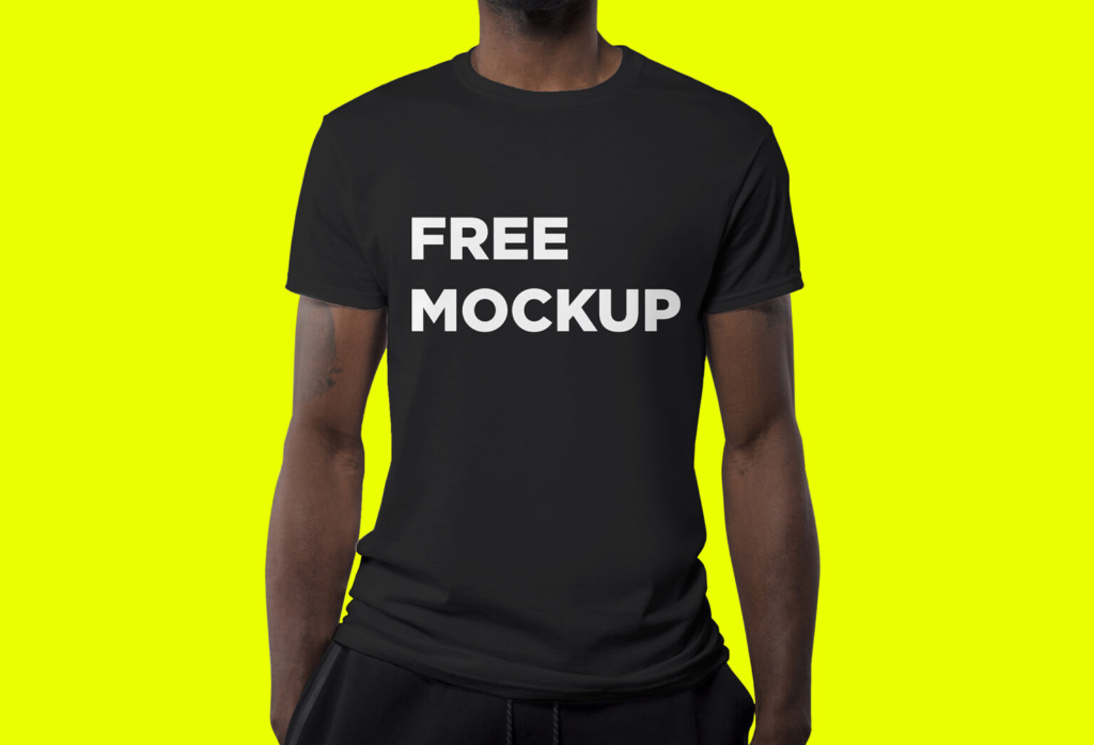 Man wearing black T-Shirt Mockup | Mockup World