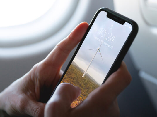 Download Iphone Xs On A Plane Mockup Mockup World